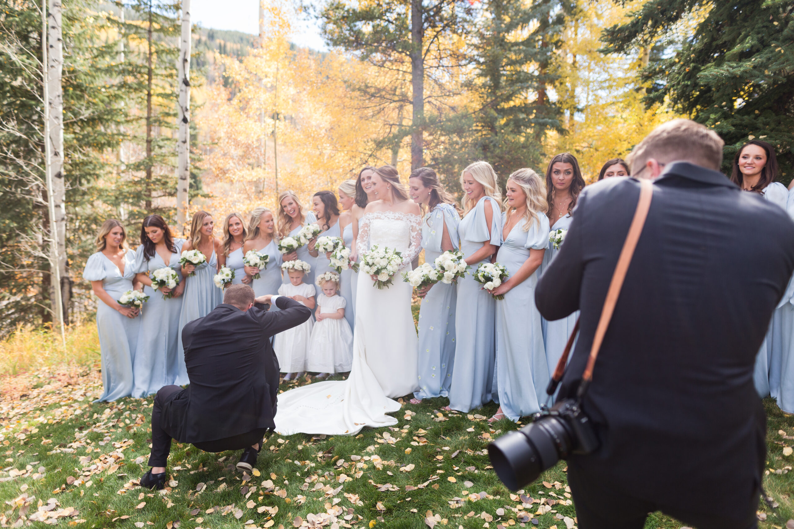 Two Photographers at a wedding photographing bridesmaids